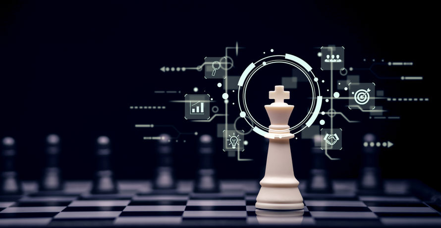 King chess piece on a chess board with floating objects around to symbolize the strategy of Private Debt & Equity used within portfolios. The symbols include a magnifying glass to correspond with research, a bar graph to represent charts, a lightbulb to represent creative ideas, silhouette of three busts symbolizing the IronBridge team, bulls-eye with dart in the center to show the importance of goals, and shaking hands to represent partnership, all as important pieces to the strategy.