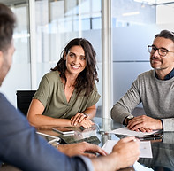 advisor and couple meeting to show the importance of regular communication and meeting to track financial goals